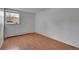 Well lit bedroom with a large window and wood-look laminate flooring at 1300 Golden Cir # 111, Golden, CO 80401