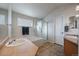 Main bathroom with a bathtub, shower, and double sink vanity at 12590 Prince Creek Dr, Parker, CO 80134