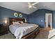 Spacious main bedroom with a large bed and ensuite bathroom access at 12590 Prince Creek Dr, Parker, CO 80134