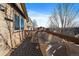 Deck with covered seating area and a view of neighboring houses at 12590 Prince Creek Dr, Parker, CO 80134