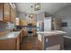 Modern kitchen with wood cabinets, stainless steel appliances, and large island at 12590 Prince Creek Dr, Parker, CO 80134