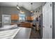 Modern kitchen with wood cabinets and stainless steel appliances at 12590 Prince Creek Dr, Parker, CO 80134