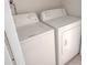 A view of the included washer and dryer inside the property at 15475 E Louisiana Ave, Aurora, CO 80017