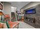 Finished basement with a bar area, stone accent wall, and cozy seating at 87 Prairie Ridge Rd, Highlands Ranch, CO 80126