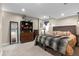 Bedroom features carpeting, neutral walls, decorative bookshelf, and closet space at 87 Prairie Ridge Rd, Highlands Ranch, CO 80126