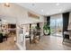 Open dining area with sliding glass doors to the backyard, and view of the fireplace and living room at 87 Prairie Ridge Rd, Highlands Ranch, CO 80126