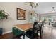 Charming dining area featuring a chandelier, modern table, and stylish accents at 87 Prairie Ridge Rd, Highlands Ranch, CO 80126