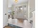 Inviting foyer with elegant front door, tile flooring, and natural light at 87 Prairie Ridge Rd, Highlands Ranch, CO 80126