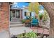 Home exterior featuring landscaped yard, seating area, and inviting entrance with steps at 87 Prairie Ridge Rd, Highlands Ranch, CO 80126