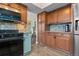 Well-equipped kitchen featuring a black range and stainless steel refrigerator at 87 Prairie Ridge Rd, Highlands Ranch, CO 80126