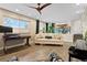 Open-concept living room filled with natural light from large windows at 87 Prairie Ridge Rd, Highlands Ranch, CO 80126