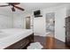 Comfortable main bedroom featuring hardwood floors and an ensuite bathroom at 87 Prairie Ridge Rd, Highlands Ranch, CO 80126