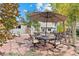 Charming backyard patio with an outdoor dining area, perfect for enjoying meals and gatherings in a serene setting at 87 Prairie Ridge Rd, Highlands Ranch, CO 80126