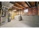 Unfinished basement utility area with exposed ceiling, washer, dryer and mechanical equipment at 5882 W 109Th Ave, Westminster, CO 80020