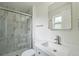 Bathroom with a glass enclosed shower and modern vanity at 5882 W 109Th Ave, Westminster, CO 80020
