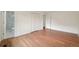A bright bedroom with wood-look floors, closet, and attached bathroom at 5882 W 109Th Ave, Westminster, CO 80020