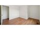 Bedroom featuring wood-look flooring, neutral paint, and ample closet space at 5882 W 109Th Ave, Westminster, CO 80020