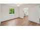 Bright dining room with hardwood floors, a new window, and updated light fixture at 5882 W 109Th Ave, Westminster, CO 80020
