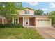 Charming two-story home with brick facade, manicured lawn and a two car garage at 5882 W 109Th Ave, Westminster, CO 80020