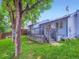 Fenced-in backyard with mature trees and a well-maintained deck with stairs down to the grass at 12646 Osceola St, Broomfield, CO 80020