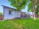 Landscaped backyard featuring a well-maintained lawn, mature trees and a multi-level deck at 12646 Osceola St, Broomfield, CO 80020