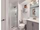 Modern bathroom with a glass-enclosed shower, updated vanity, and contemporary fixtures, creating a clean and stylish space at 12646 Osceola St, Broomfield, CO 80020