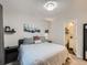 Cozy bedroom featuring neutral colors, a window, carpet floors, and an ensuite bathroom at 12646 Osceola St, Broomfield, CO 80020