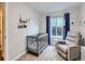 Cozy Bedroom featuring plush carpet, a rocker, a crib, and ample natural light from the window at 12646 Osceola St, Broomfield, CO 80020