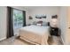 Serene bedroom features a window, carpet, neutral decor, and curated decor, creating a cozy retreat at 12646 Osceola St, Broomfield, CO 80020