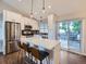 Modern kitchen with stainless steel appliances, sleek countertops, and a breakfast bar at 12646 Osceola St, Broomfield, CO 80020