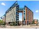 Striking building exterior featuring modern architecture, sleek lines, and ample glass, offering a vibrant urban lifestyle at 1901 Wazee St # 419, Denver, CO 80202