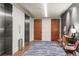 Hallway area featuring wood-like flooring and carpet runner near elevator entrance adjacent to doors to residences at 1901 Wazee St # 419, Denver, CO 80202