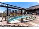 Modern rooftop pool offering city skyline views, lounge chairs, and covered seating area at 1901 Wazee St # 419, Denver, CO 80202