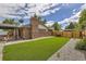 Large backyard with lush turf, grill, and an outdoor seating area at 7746 S Gray St, Littleton, CO 80128