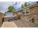 Brick patio with hot tub with privacy fence at 7746 S Gray St, Littleton, CO 80128