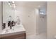 White bathroom features double sinks and a seperate toilet and shower room at 7746 S Gray St, Littleton, CO 80128