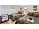 Shared bedroom with matching beds and a crib at 7746 S Gray St, Littleton, CO 80128