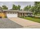 Charming home with a two-car garage and an extra-long driveway at 7746 S Gray St, Littleton, CO 80128