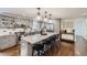 Modern kitchen with stainless appliances, granite countertops, ample cabinet space, and a large center island at 7746 S Gray St, Littleton, CO 80128