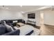 Finished basement with large couch and modern decor at 7746 S Gray St, Littleton, CO 80128
