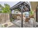 Covered outdoor patio with comfortable seating and string lights, perfect for relaxing at 7746 S Gray St, Littleton, CO 80128