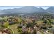 Scenic aerial shot of a community nestled in a lush valley with mountain views at 3620 Silver Plume Ln, Boulder, CO 80305
