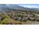 Breathtaking aerial view of a neighborhood surrounded by mountains and natural landscape at 3620 Silver Plume Ln, Boulder, CO 80305