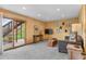 Cozy basement area with a sliding door leading to the backyard, perfect for relaxation at 3620 Silver Plume Ln, Boulder, CO 80305