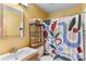 Cozy bathroom featuring a neutral vanity, modern sink and colorful patterned shower curtain at 3620 Silver Plume Ln, Boulder, CO 80305