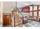 Inviting living room with high ceilings, open staircase, and stylish decor at 3620 Silver Plume Ln, Boulder, CO 80305