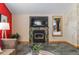 Cozy living room featuring a tiled fireplace and warm, inviting ambiance at 3620 Silver Plume Ln, Boulder, CO 80305