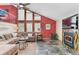 Spacious living room with a fireplace, large windows, and comfortable seating area at 3620 Silver Plume Ln, Boulder, CO 80305
