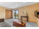 Inviting living room featuring a sofa, side table, sliding glass doors to patio, and a mounted television at 3620 Silver Plume Ln, Boulder, CO 80305