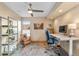 Home office featuring a ceiling fan, work station, a comfortable chair, and built in shelving at 3620 Silver Plume Ln, Boulder, CO 80305